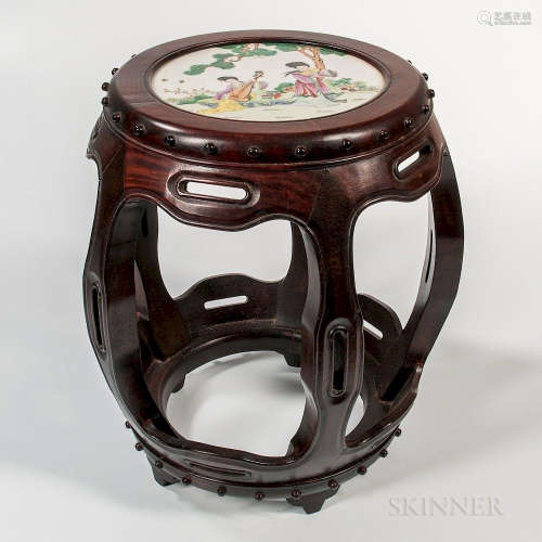 Enameled Porcelain-top Wood Stool, China, late 20th century, barrel-shape, the round porcelain top decorated with a garden scene with a