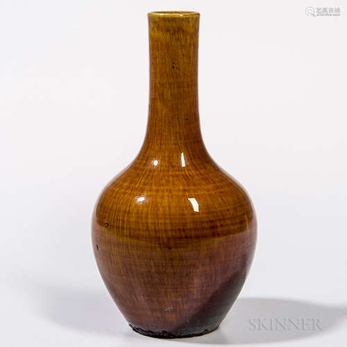 Caramel Flambe Vase, China, 18th century, bottle shape with elongated neck covered with a crackled glaze of deep caramel color thinning