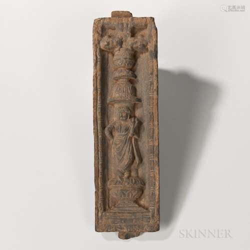 Gandharan Gray Schist Stele, Kushan, possibly 2nd/3rd century, depicting a Yakshi standing on a plinth and holding a branch, the elabor