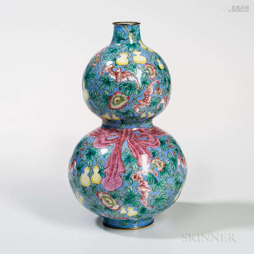 Canton Enamel Double Gourd Vase, China, 19th century, with bats amid gourd vines, against a blue ground with a pink ribbon around the c