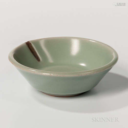 Small Celadon-glazed Dish, China, Song dynasty style, with slanted sides, resting on a raised bisque foot ring, plain, (one-inch repair