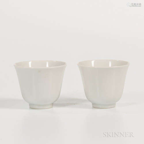 Pair of White Porcelain Wine Cups, China, 19th century, upturned bell-shape with flaring mouth, six-character Tongzhi mark on base, ht.