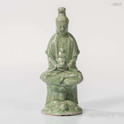 Crackled Celadon-glazed Figure of Guanyin, China, seated cross-legged on a lotus above a turtle, with a bowl in her hands, allover gray
