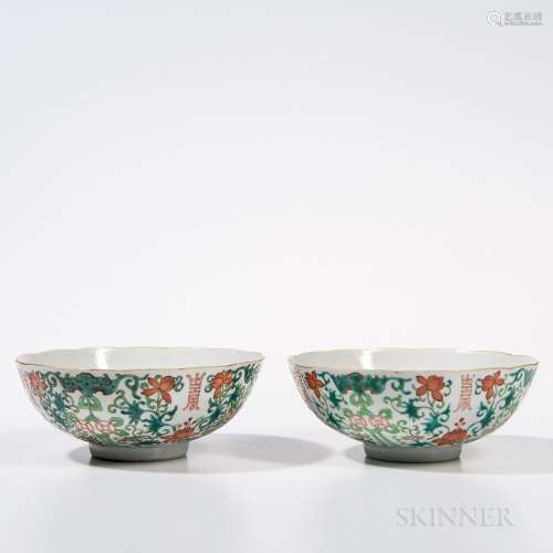 Pair of Famille Rose Bowls, China, early 19th century, with floral rims, on a foot ring, decorated with lotus scroll design with shou c