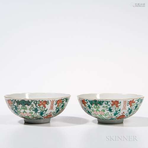 Pair of Famille Rose Bowls, China, early 19th century, with floral rims, on a foot ring, decorated with lotus scroll design with shou c