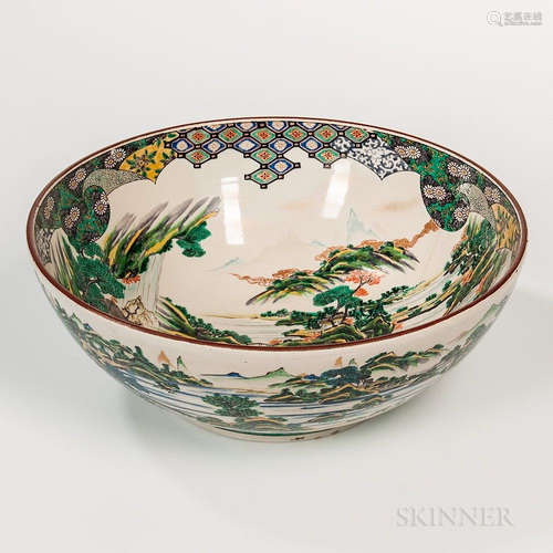 Large Ko-Kutani Yoshidaya Bowl, Japan, possibly 18th century, on a short raised foot, decorated with a landscape below a patterned band