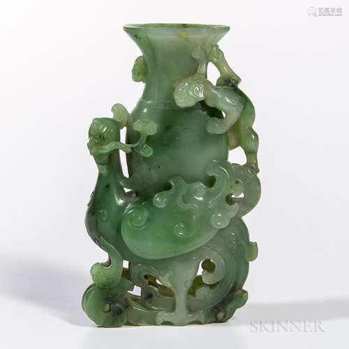 Green Hardstone Vase, China, a phoenix-tail-form vase supported on the back of a carved phoenix, with a chilong at the neck, decorated