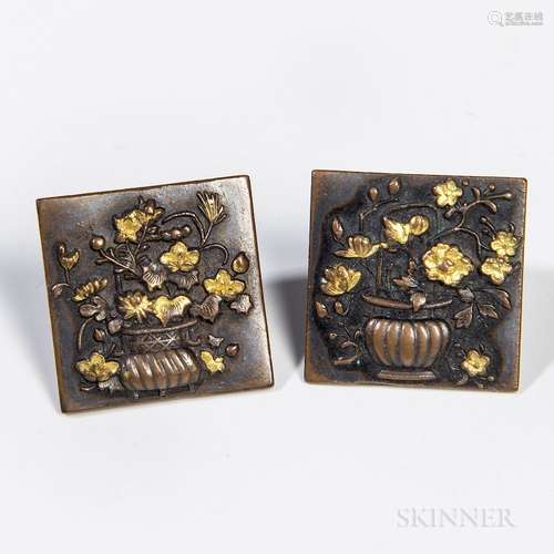 Pair of Square Bronze Cuff Links, Japan, 20th century, with a floral basket design in relief, gilt details, wd. 1 7/8 in. Provenance: F