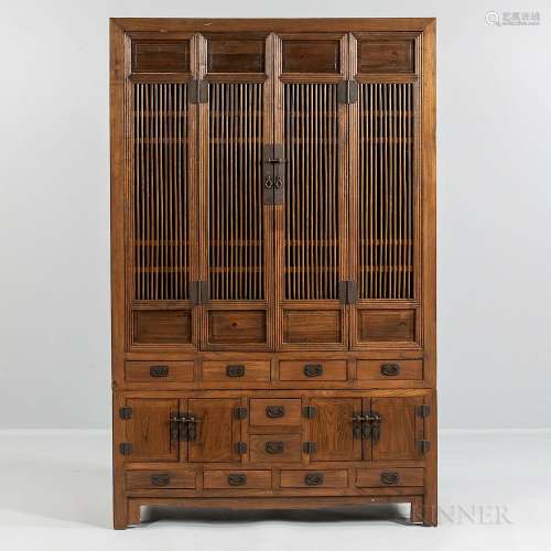 Elmwood Compound Cupboard, China, 20th century, upper case with two spindle-paneled doors flanked by conforming fixed panels, interior
