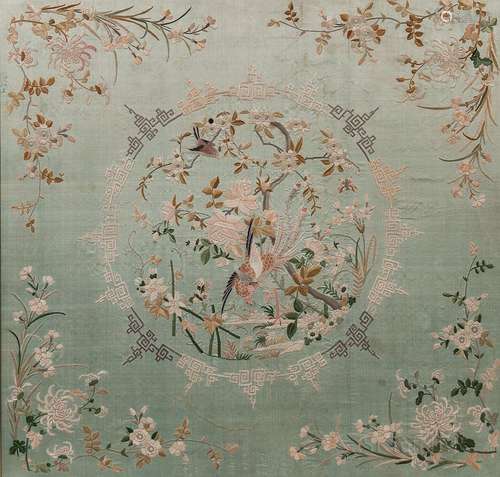 Embroidered Panel, China, early 20th century, depicting a phoenix within a roundel of flowering branches, surrounded by birds, flowerin