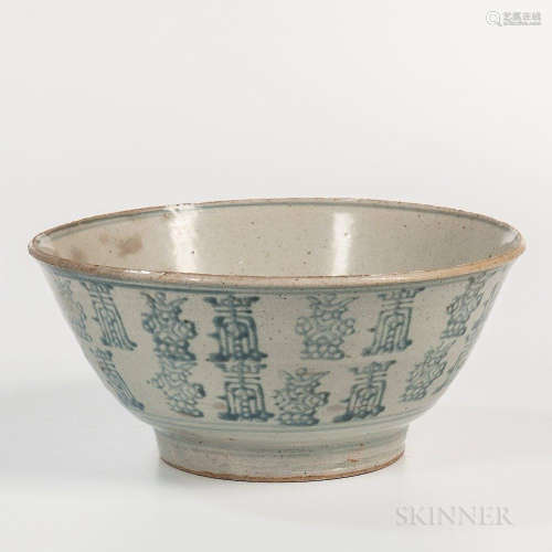 Large Blue and White Swatow Bowl, China, 18th/19th century, thickly potted, on a raised foot, decorated with two alternating calligraph