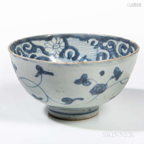 Swatow Blue and White Bowl, China, possibly Ming dynasty, well-rounded, on a short raised foot, decorated with stylized floral scrolls