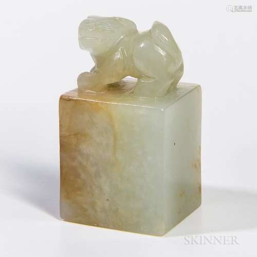 Small Nephrite Jade Seal, China, square form surmounted by a carved foo dog, pale celadon stone with russet markings, illegible incised