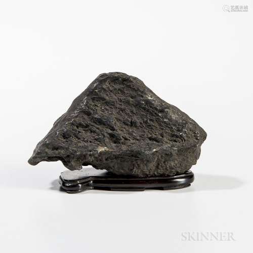 Scholar's Rock, China, in the shape of a mountain with one flat side, on wood stand, rock ht. 4, wd. 6 3/4 in.