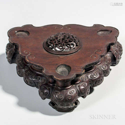 Large Carved Wood Stand, China, designed to hold a vessel with tripod feet, decorated with a domed stylized openwork lotus carving at t