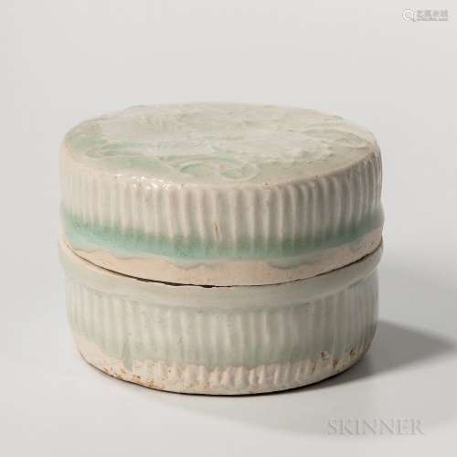 Small Qingbai-glazed Box and Cover, China, Song dynasty style, round form with straight ribbed sides, the cover decorated with molded f