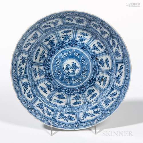 Export Blue and White Dish, China, Kangxi style, with barbed rim, decorated with lappet and patterned bands encircling a floral roundel