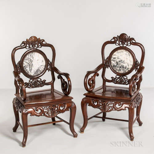 Pair of Hardwood Armchairs, China, late 20th century, with trapezoid seat, foliate scroll armrests and cabriole legs, decorated with ci