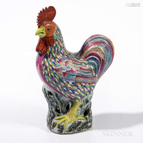 Polychrome Enameled Rooster, China, 19th/20th century, seated on a rock with its left leg down, the head slightly turned to one side, h