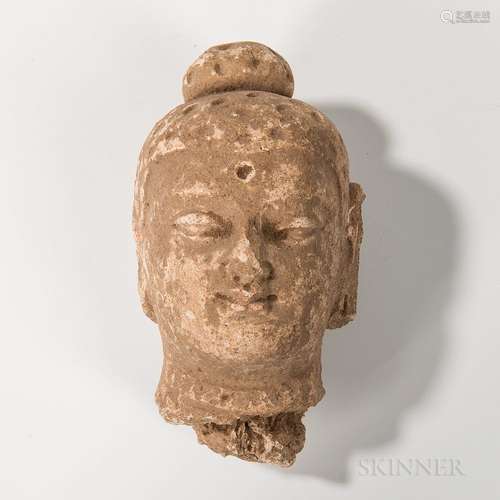 Gandharan Stucco Buddha Head, Kushan, possibly 4th/5th century, the finely carved head with heavy lidded eyes and full lips, with impre