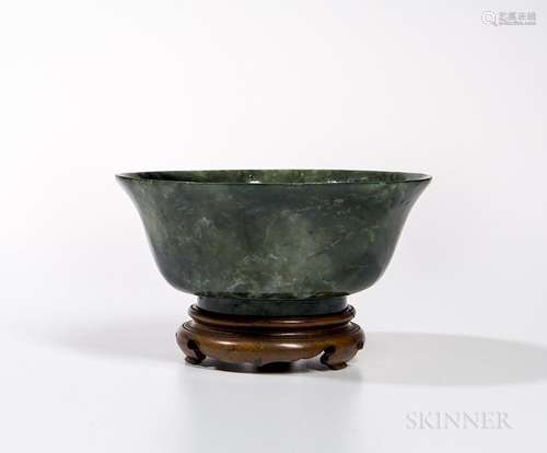 Spinach Jade Bowl, China, 20th century, deep sides curving to an everted rim and rising from a strong foot, dark green stone with numer