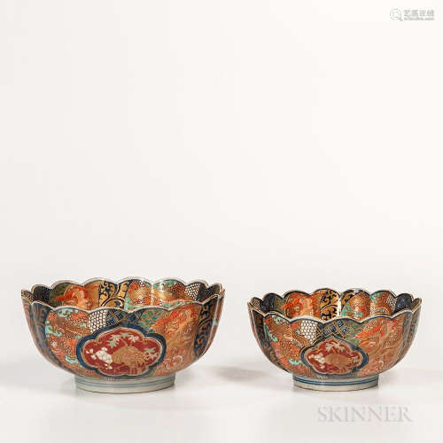 Set of Two Imari Bowls, Japan, 19th century, ribbed floral form, on a raised foot, decorated in sections with dragons and phoenixes, fo