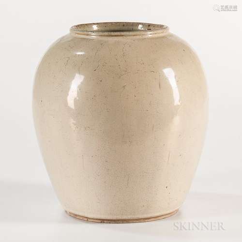 Cream-glazed Jar, China, oval with rolled rim, slightly raised bisque foot and base, fine allover crackling, ht. 8 1/4 in.