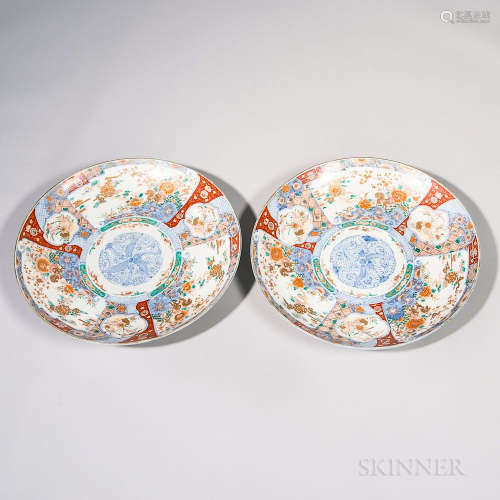 Pair of Monumental Imari Chargers, Japan, 19th/20th century, decorated in sections with auspicious flora and fauna, gilt rim, a foliate