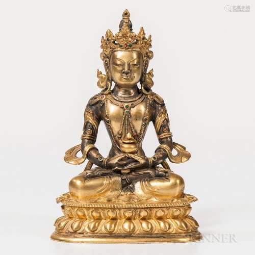 Gilt-bronze Figure of Avalokitesvara, Sino-Tibet, 18th century, seated in dhyanasana on a double lotus throne, with hands in dhyana wit