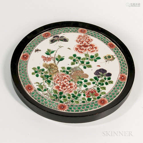 Famille Verte Plaque, China, Kangxi style, circular, decorated with a bird and flower with butterflies, encircled with a floral honeyco