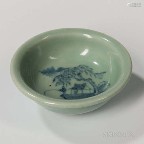 Celadon Dish, China, low bowl-shape with flaring mouth on a raised foot, the well with a landscape in underglaze blue, ht. 1 5/8, dia.