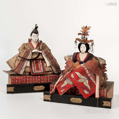 Hina Dolls of an Emperor and Empress, Japan, 1904, seated on a rectangular platform, dressed in formal kimonos with the emperor holding