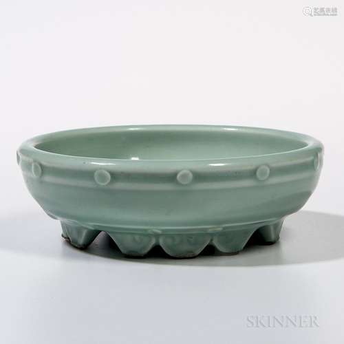 Celadon Bulb Bowl, China, 18th century, the shallow bowl with rounded sides and a band of evenly placed studs on the exterior, with twe