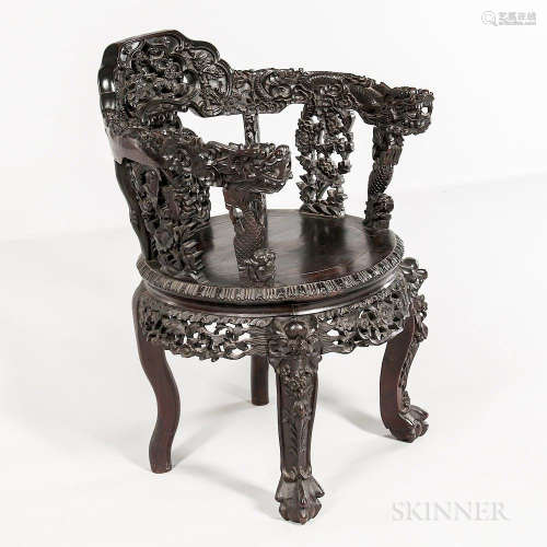 Rosewood Chair, China, 19th/20th century, with round seat, decorated with carved openwork designs, dragon to armrests, mythical bird he