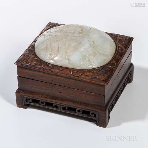 Jade and Wood Box, China, 19th/20th century, the hinged box top carved with scrolling flowers and leaves surrounding a domed carved jad