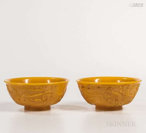 Pair of Yellow Peking Glass Bowls, China, 19th century, on a short splayed foot, decorated with a landscape with warriors and officials