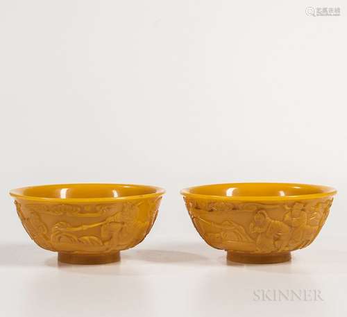 Pair of Yellow Peking Glass Bowls, China, 19th century, on a short splayed foot, decorated with a landscape with warriors and officials