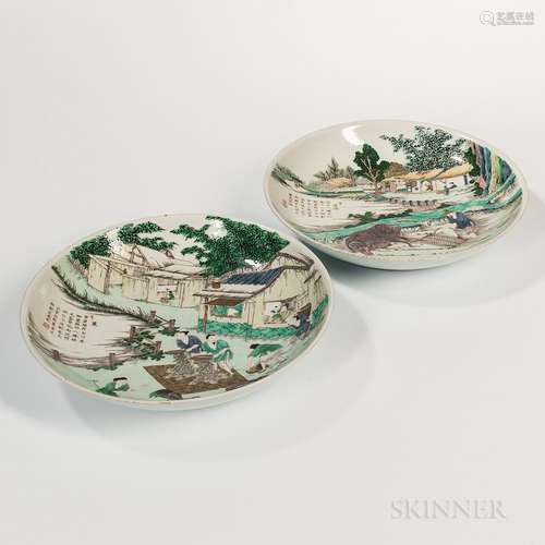 Pair of Famille Verte Chargers, China, Kangxi style, depicting a rural landscape with households with men at work with sieves on one, w