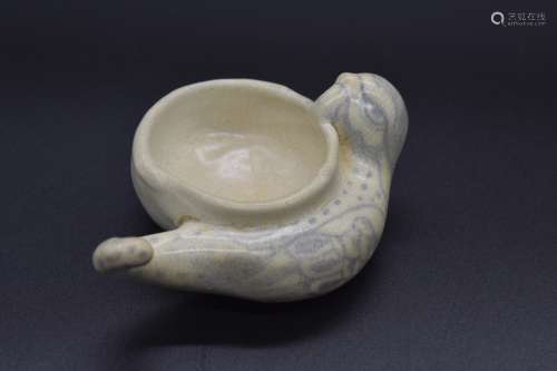 A Chinese blue and white brushwasher in the form of a phoenix- Tang dynasty, 8th century.