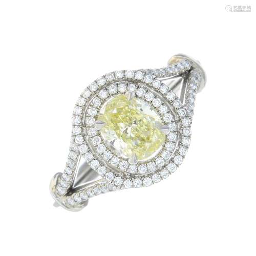 A coloured diamond and diamond cluster ring.