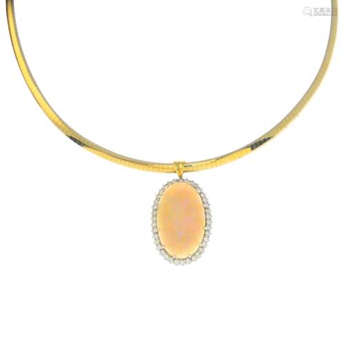 An 18ct gold opal and diamond pendant.