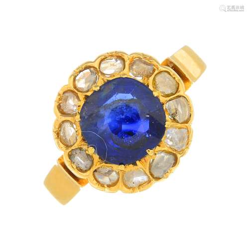 An early 20th century 18ct gold sapphire and diamond cluster ring.