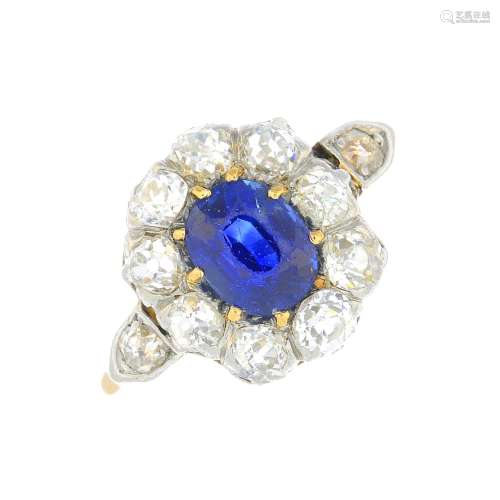 An 18ct gold and platinum, sapphire and diamond ring.