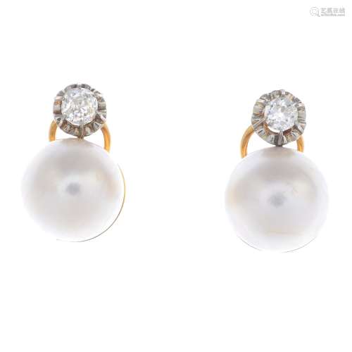 A pair of mabe pearl and diamond earrings.