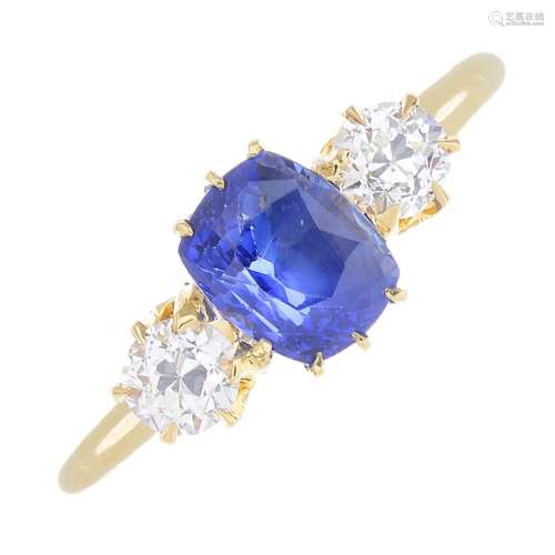 An early 20th century 18ct gold sapphire and diamond three-stone ring.