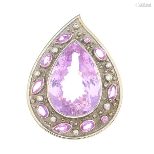 A kunzite, sapphire and diamond pendant.