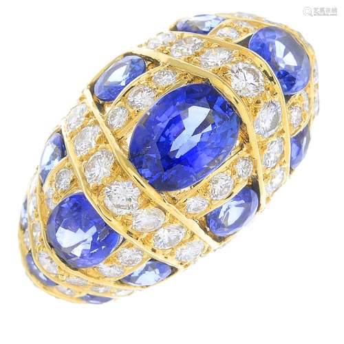 BUCHERER- an 18ct gold sapphire and diamond dress ring.