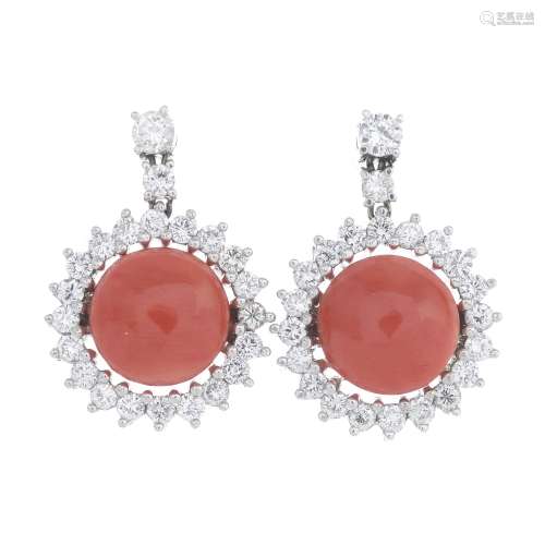 A pair of coral and diamond cluster earrings.