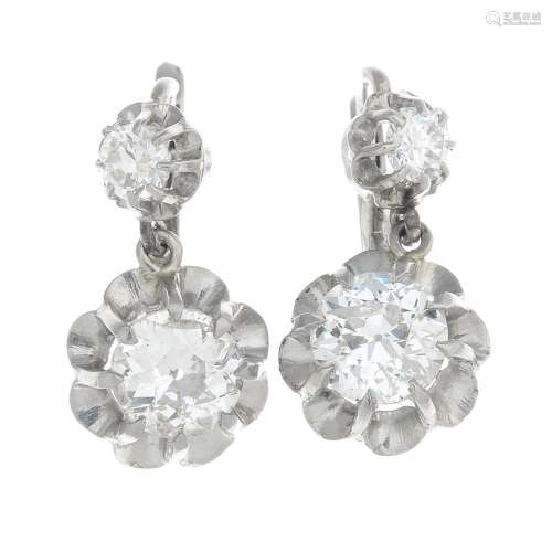 A pair of early 20th century platinum and 18ct gold diamond earrings.