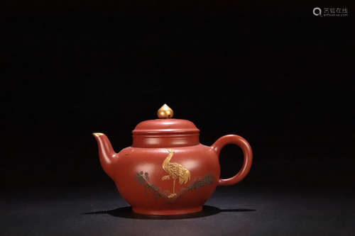 AN OLD YIXING PURPLE CLAY TEAPOT